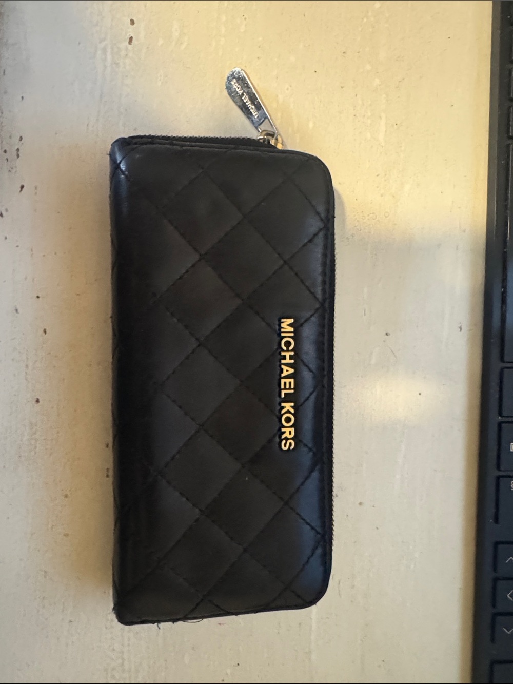 Michael Kors Black Quilted Zip Around Wallet with Gold Logo